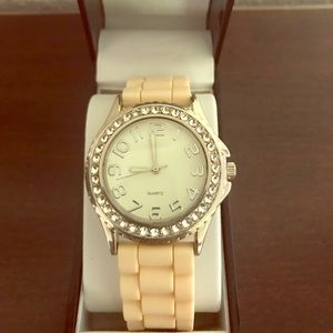 Silver and crystal watch with silicone band.